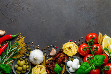 Italian food on a dark background with copy space, ingredients f