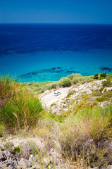Tourist car on the coast road on Lefkada Greece