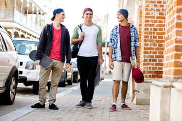 Teenage friends walking at the street