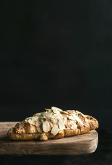 Fresh baked croissant with almonds slices served,selective focus