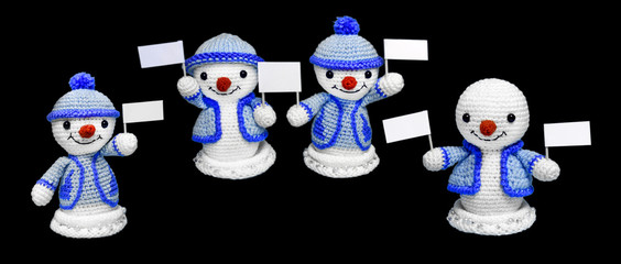 four happy snowman toys with advertising on a black background, isolate