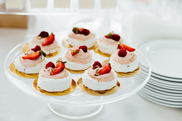 Table with loads of cakes, cupcakes, cookies and cakepops.
