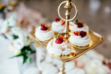 Table with loads of cakes, cupcakes, cookies and cakepops.