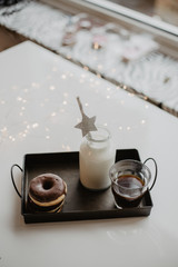 Donuts and milk in a botlle