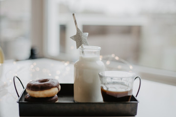 Donuts and milk in a botlle