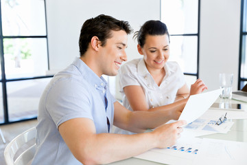 Obraz premium Image of two young business people in office