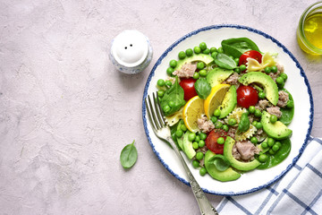 Pasta salad with spinach,avocado,salted salmon and green pea.Top view.