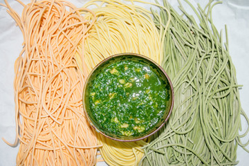 Colourful Italian pasta tagliatelle with pesto sauce