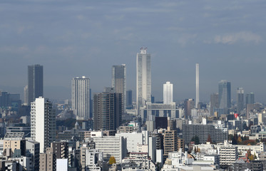 日本の東京都市風景・スポット光があたる高層ビルなどを望む（池袋の高層ビル群などを望む）