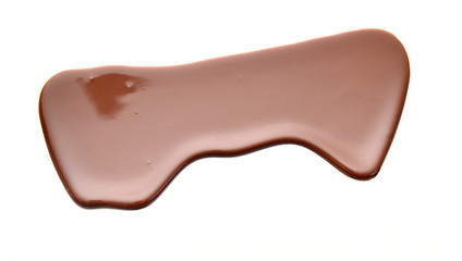 Close up of chocolate syrup leaking on white background
