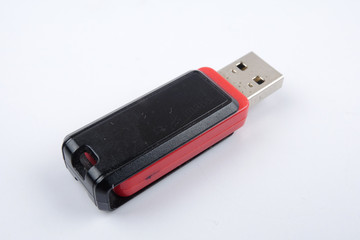 Black and red flash drive isolated on white background.