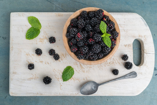 Bowl with blackberries and mint leaves