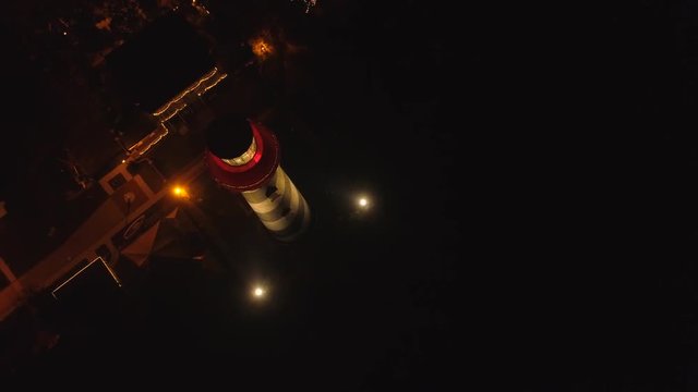 Aerial shot pull out lighthouse night drone video 4k 24p