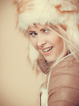 Blonde woman in winter furry hat