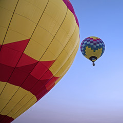 Isolated Skyward View of Hot Air Balloon Against Clear Blue Sky 