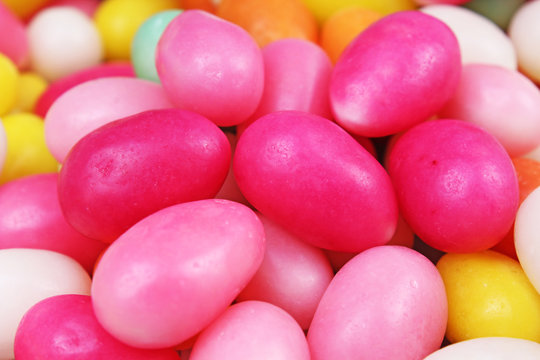 Easter candy. Egg shaped sugar candy for easter season. Egg shaped candy. Pink yellow.