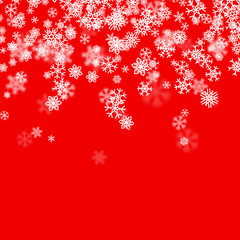 Christmas snow background with scattered snowflakes falling in winter