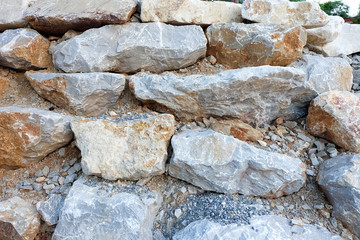 Real stone wall texture background stacked layers are uneven
