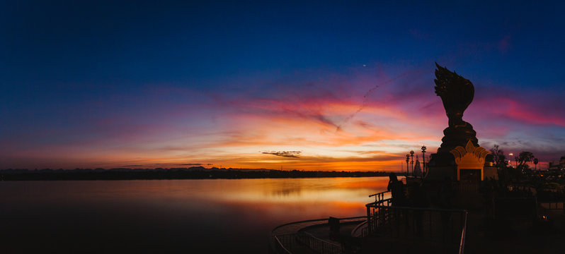 NAKHON PHANOM, THAILAND - DEC 26 : Yard serpent spits water on the Mekong River in Nakhon Phanom with sunrise scene on December 26, 2016.