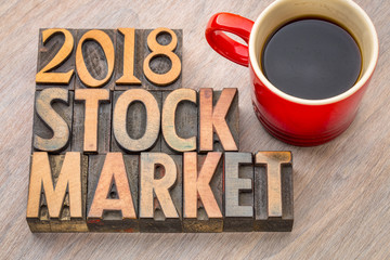 2018 stock market word abstract in wood type