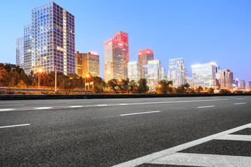Fototapeta na wymiar Asphalt highway and modern business district office buildings in Beijing at night,China