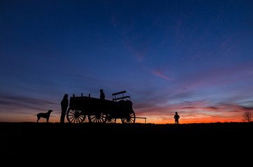 Family enjoys a walk at sunset on Wagon Hill Farm in Durham, NH