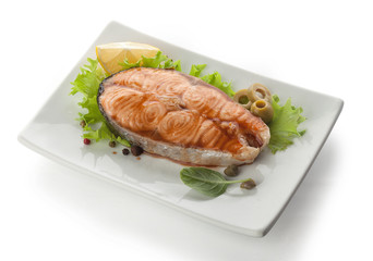 baked steak of salmon with olives and lemon