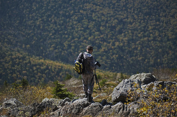 photographer in the mountains autumn mountains nature of the Far East of Russia
