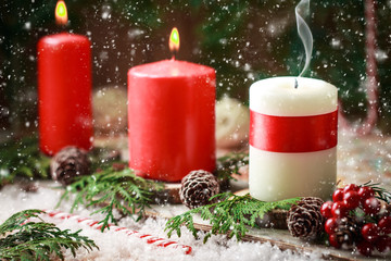 Christmas card with burning candles and decorations. 