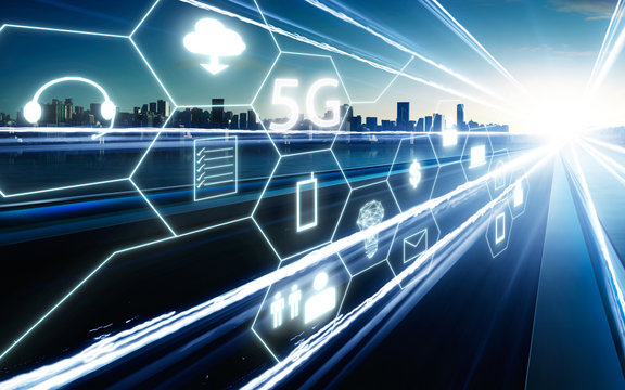 5G network wireless systems and internet of things with  highway overpass motion blur with city skyline background .