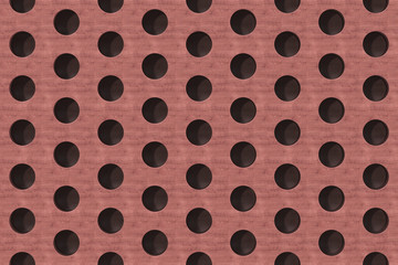Plain red wooden surface with cylindrical holes