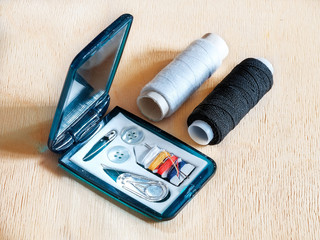 Road sewing kit and spools of thread 