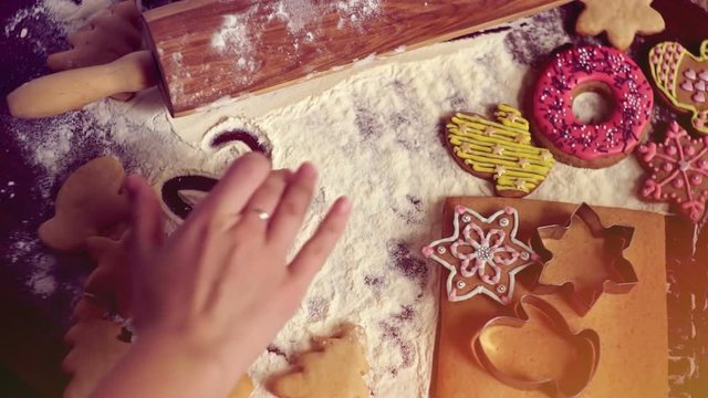 Christmas baking background. The girl writes on a table 2018