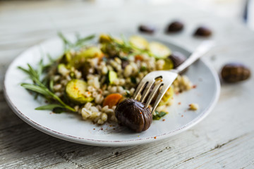 Chestnut salad with pearl barley and vegetables.