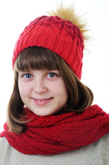 Portrait of young girl in hat and scarf