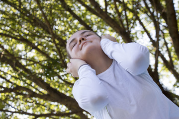 Teenager is listening to music with big headphone