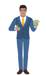 Businessman with cash money and showing thumb up