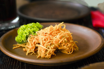Korean carrot with green leaf lettuce on plate