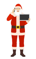 Santa Claus talking on the mobile phone and showing blank digital tablet PC