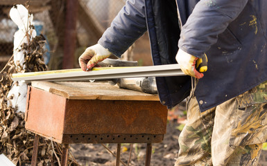 Workers walling the house with wall siding