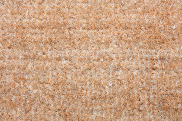 Fototapeta premium Beige carpet texture. A close up background