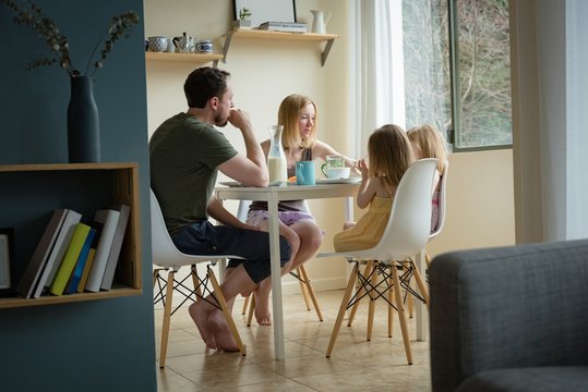 Family having breakfast in kitchen