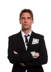 Image of man in business suit with dollars in pockets