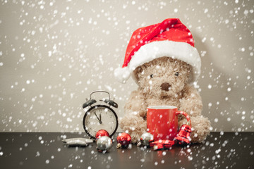 Teddy bear with red santa hat.