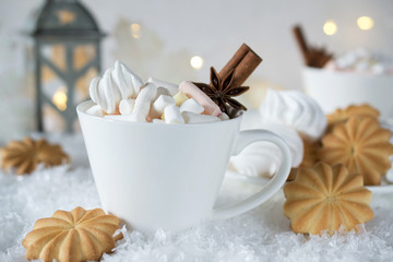 Holiday cup of  cocoa with marshmallow or coffee with spice and home cookies. Christmas background.