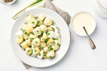 Potato salad with eggs and green onion