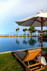 wood  sunbeds and umbrellas on the beach