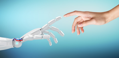 Human hand touching an android hand.