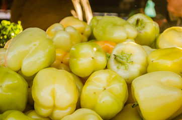 Fresh yellow peppers on the market