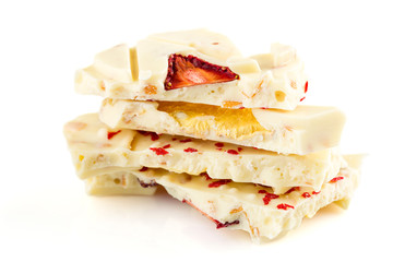 Stack of white chocolate bar pieces with dried fruit